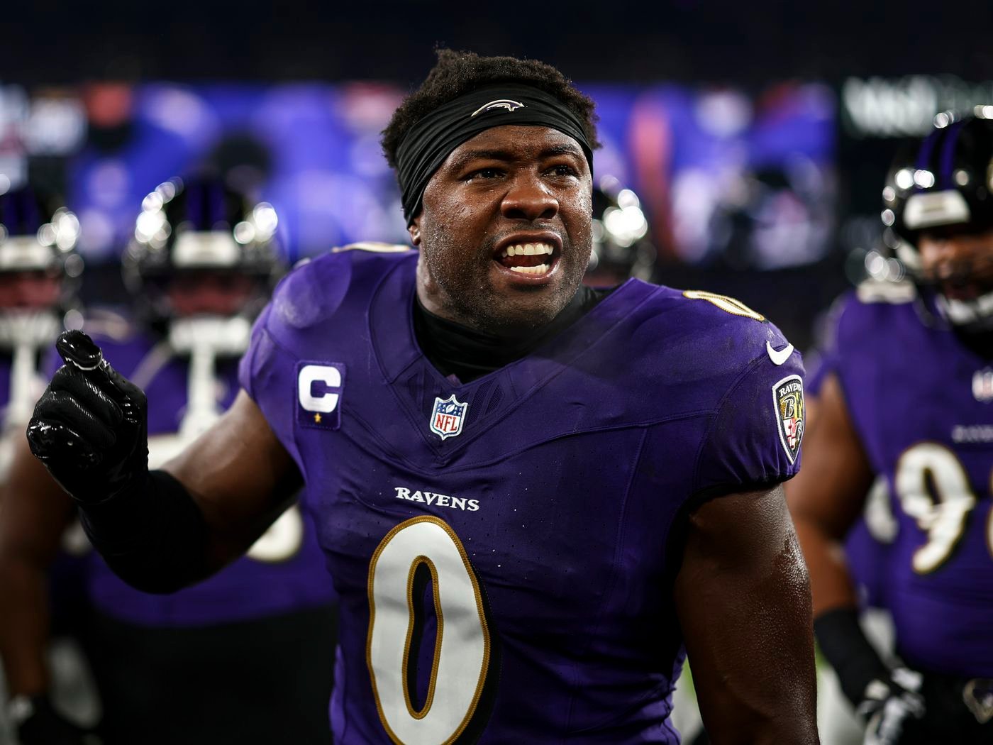 a man in a purple uniform