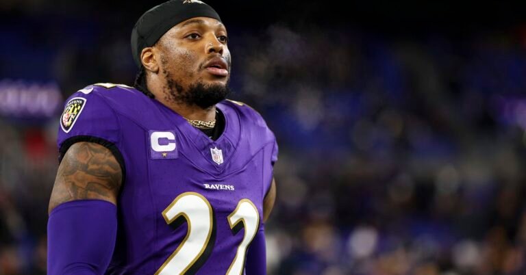 a man in a purple jersey
