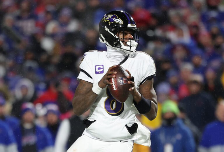 a football player holding a football