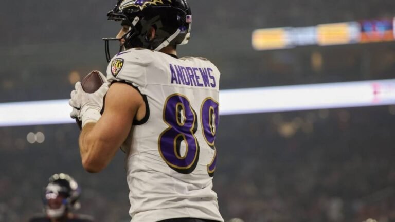 a football player holding a football