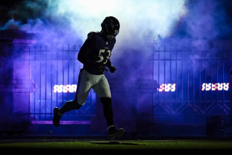 a football player running on a field