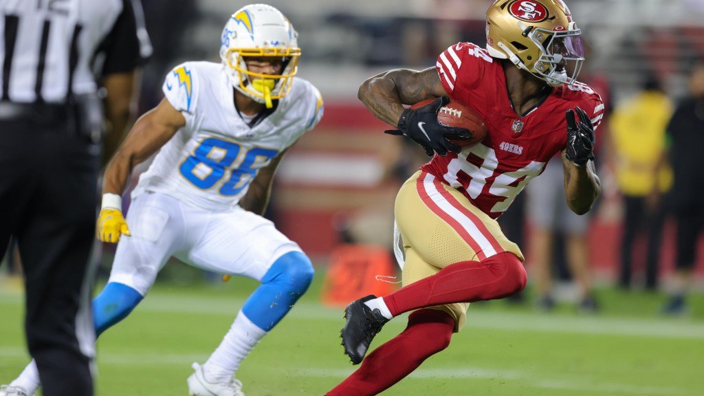 a football player running with a ball