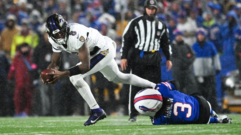 a football player falling into a ball