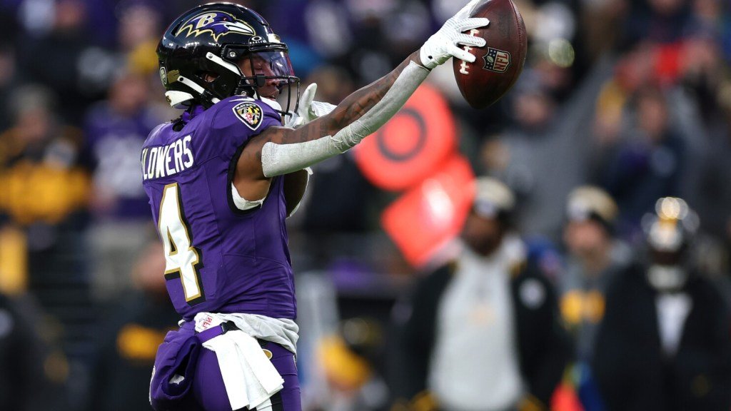 a football player catching a football