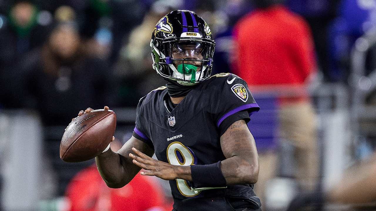a football player holding a football