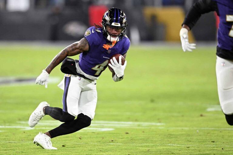 a football player running with a football