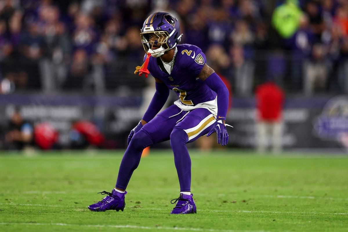 a football player in a purple uniform