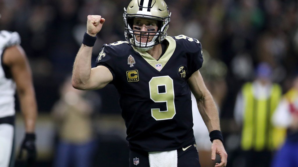 a football player in a uniform with his fist up
